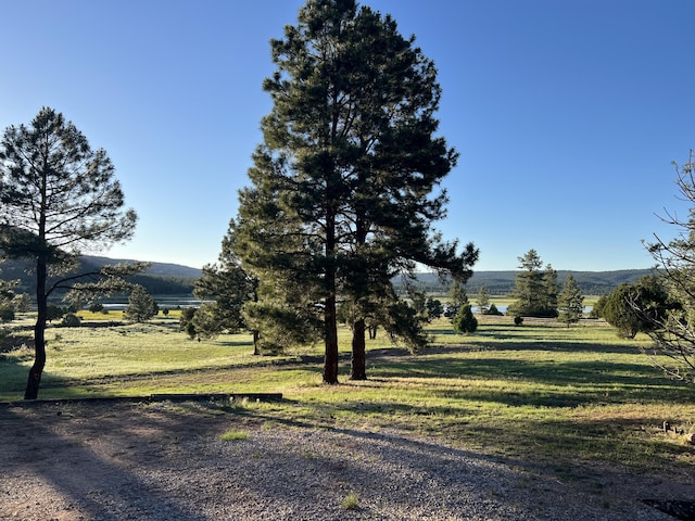 exterior space with a rural view and a mountain view