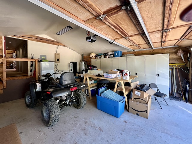 garage with gas water heater, electric panel, and a garage door opener