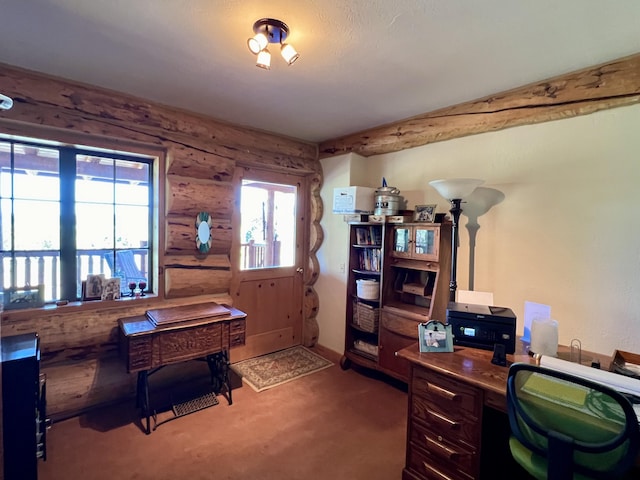 carpeted office featuring log walls