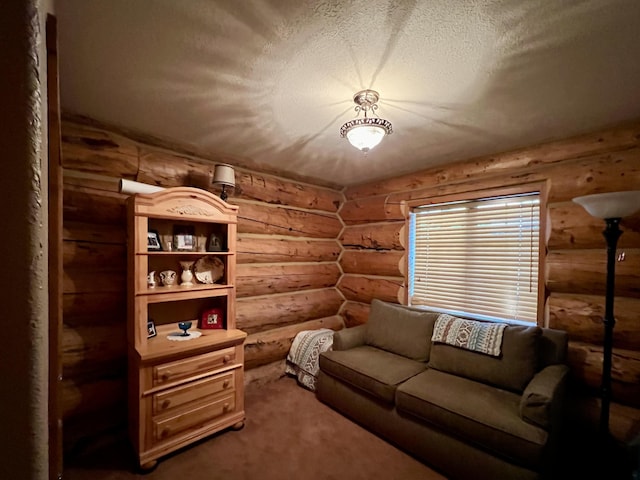 interior space featuring log walls, a textured ceiling, and carpet flooring