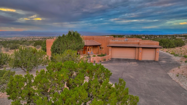 view of front of property featuring a garage