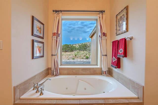 bathroom with tiled bath