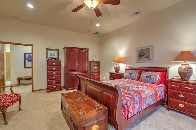 bedroom with ceiling fan and light colored carpet