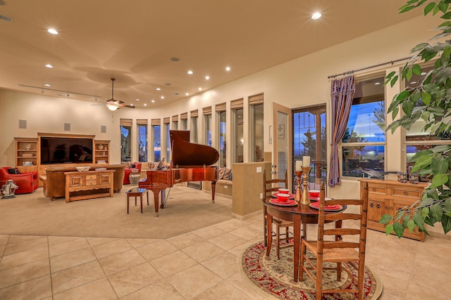 dining room featuring light tile patterned floors and ceiling fan