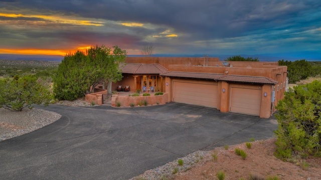 southwest-style home with a garage