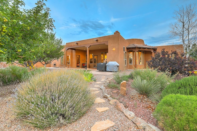 rear view of house with a patio