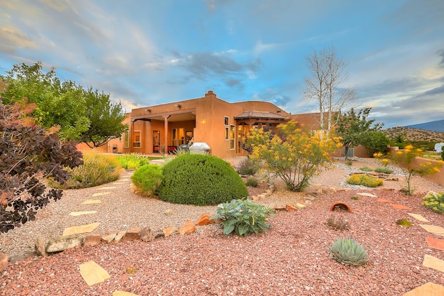 back of property with a patio area