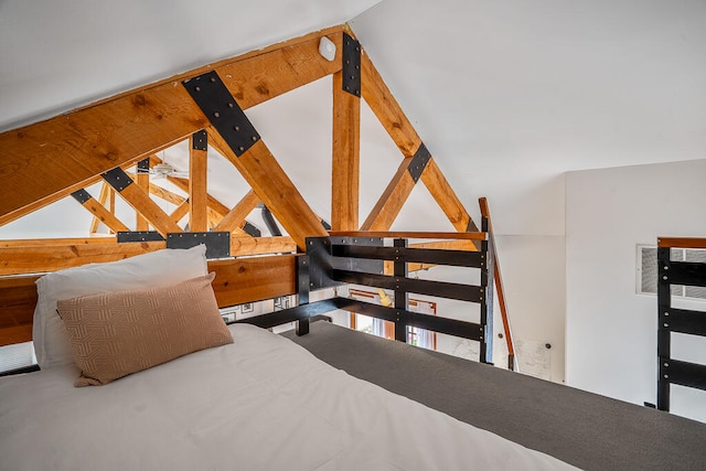 bedroom with lofted ceiling