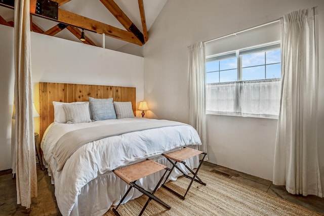 tiled bedroom with lofted ceiling