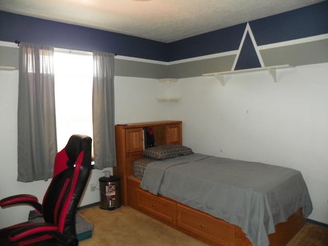 bedroom featuring light carpet