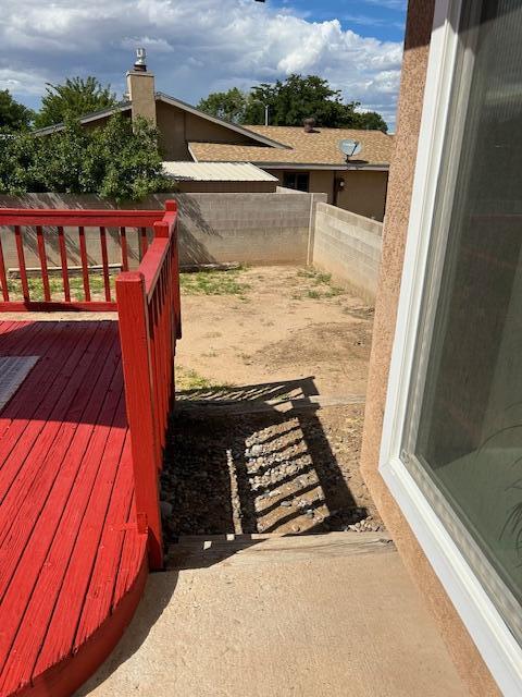 deck with a fenced backyard