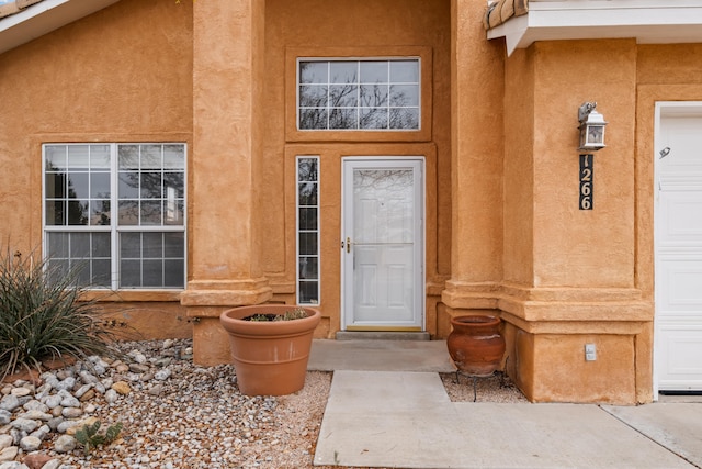 view of exterior entry featuring a garage