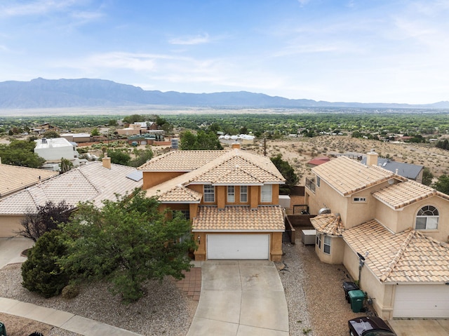 birds eye view of property featuring a mountain view