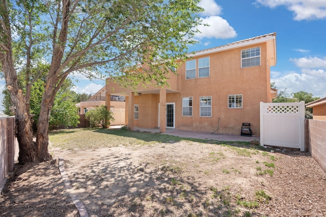 rear view of house with a patio