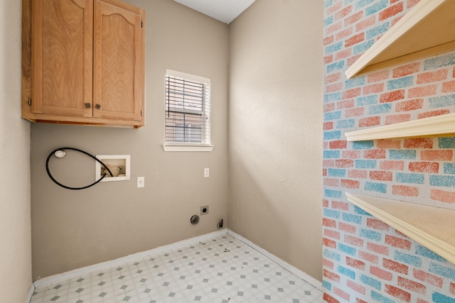 laundry area featuring hookup for an electric dryer, washer hookup, and cabinets