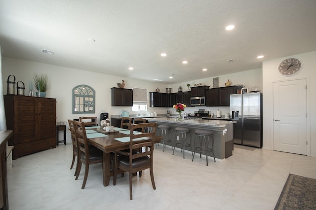 dining area featuring a textured ceiling