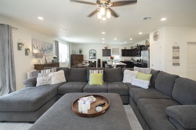 living room featuring ceiling fan