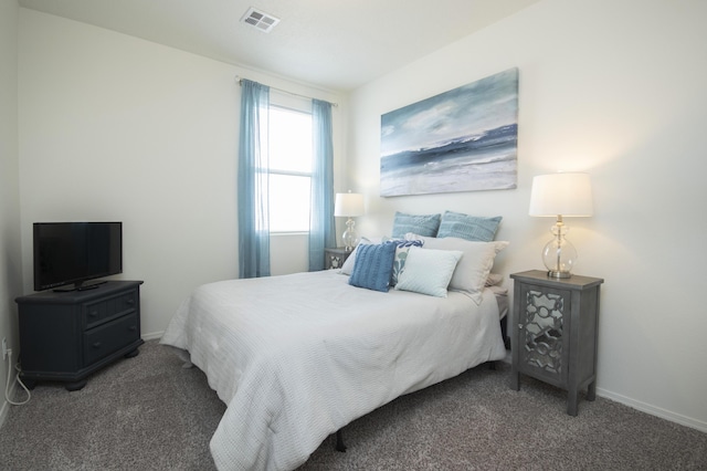 bedroom with dark carpet