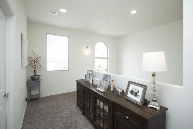 office space featuring dark colored carpet