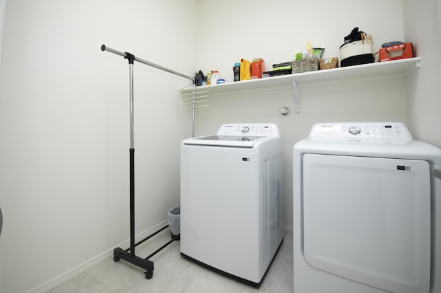 clothes washing area featuring separate washer and dryer