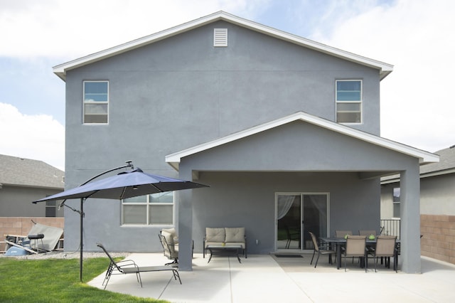 back of house with a patio area