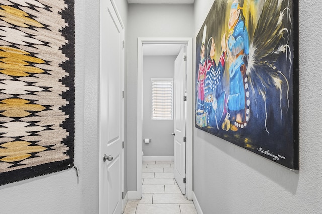 corridor featuring light tile patterned flooring