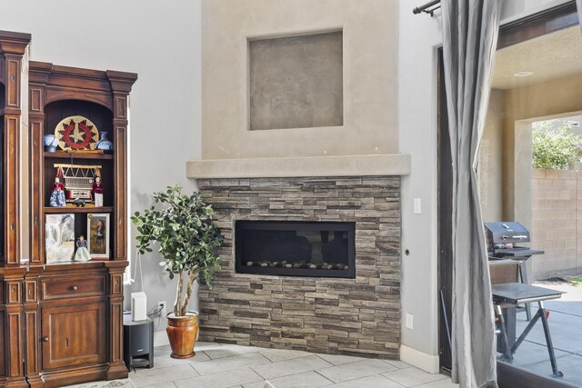 tiled living room with a fireplace