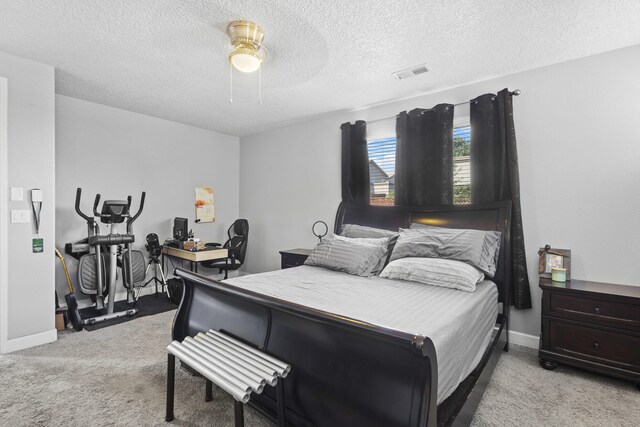 bedroom with light carpet, a textured ceiling, and ceiling fan