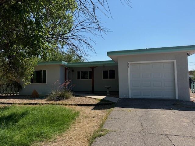 ranch-style house featuring a garage