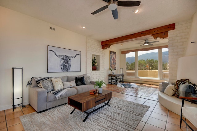 tiled dining area with an inviting chandelier and a baseboard heating unit