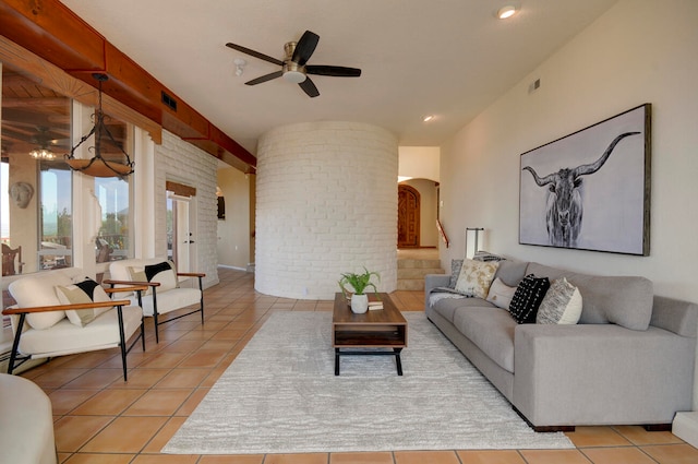 dining room featuring baseboard heating, light tile patterned floors, and ceiling fan