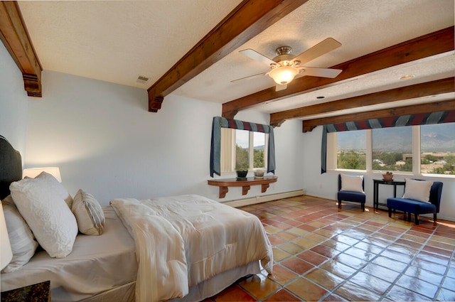 interior space featuring brick wall, ceiling fan, tile patterned floors, and a baseboard heating unit