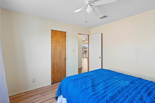 bedroom featuring ceiling fan and light hardwood / wood-style floors