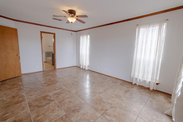 empty room with ceiling fan and crown molding