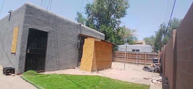 view of property exterior featuring a lawn