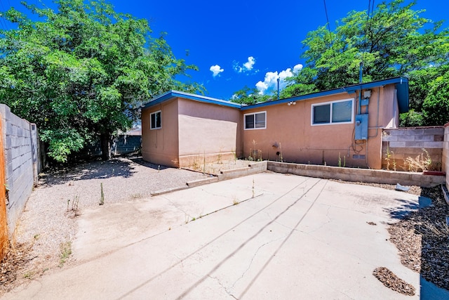 back of property featuring a patio area