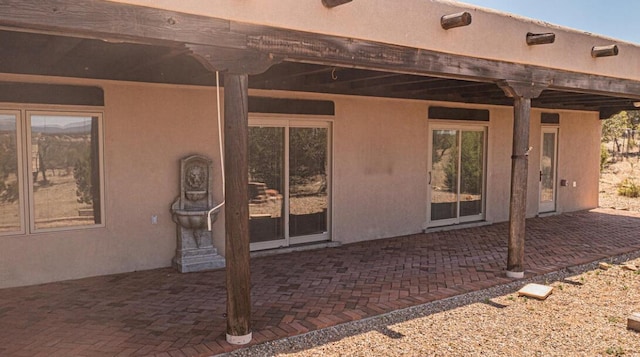 back of property featuring a patio
