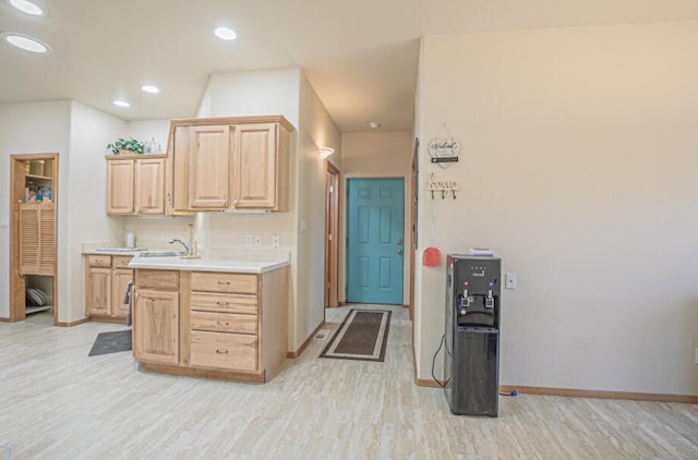 kitchen featuring light hardwood / wood-style floors, sink, and light brown cabinetry