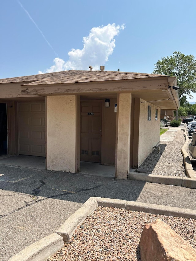 doorway to property featuring a garage