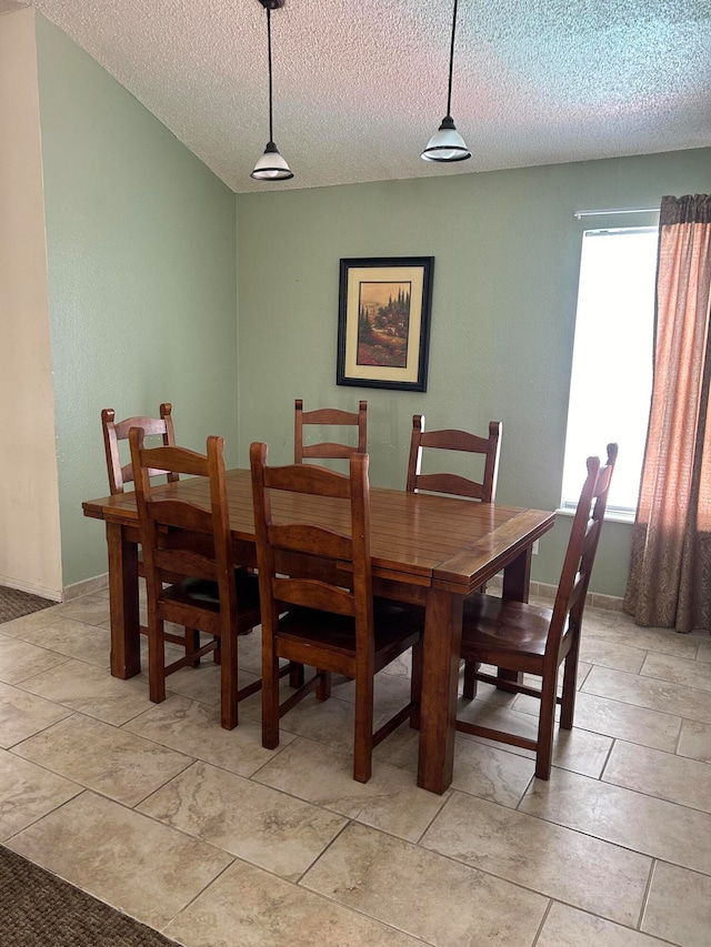 dining area with a textured ceiling