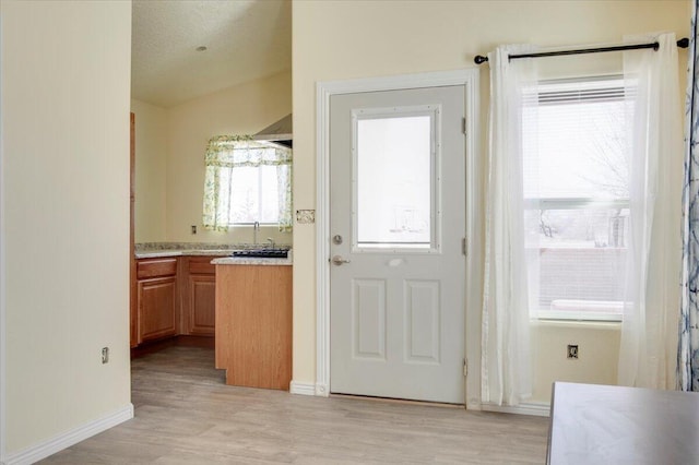 doorway with light hardwood / wood-style floors