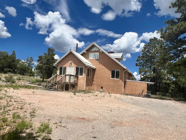 view of front of house with central AC unit