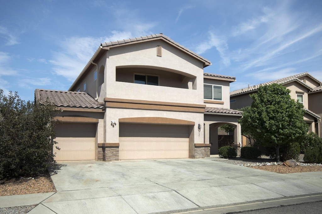 mediterranean / spanish house featuring a garage