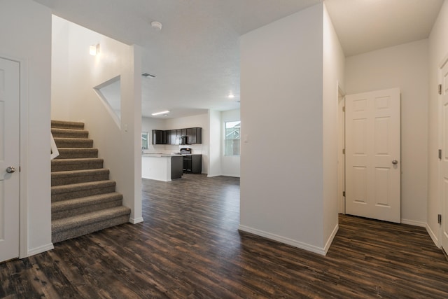 6213 White Hawk Dr NE, Rio Rancho, NM 87144 - entrance foyer featuring dark wood finished floors and stairway