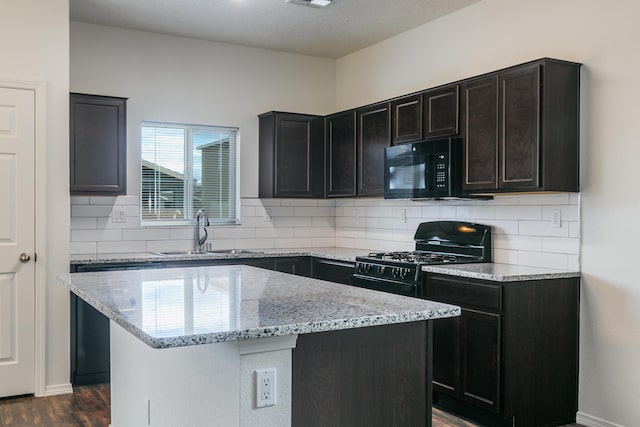 6213 White Hawk Dr NE, Rio Rancho, NM 87144 - kitchen featuring black appliances, tasteful backsplash, light stone counters, and dark wood-style floors