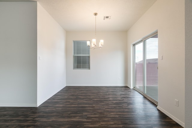 6213 White Hawk Dr NE, Rio Rancho, NM 87144 - unfurnished dining area featuring a chandelier and dark wood-style flooring