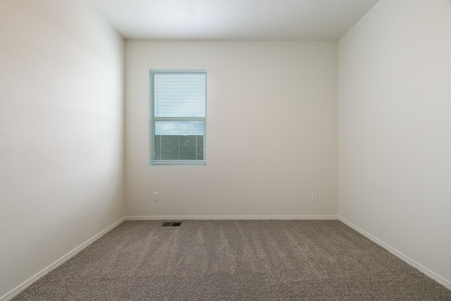6213 White Hawk Dr NE, Rio Rancho, NM 87144 - carpeted spare room with baseboards