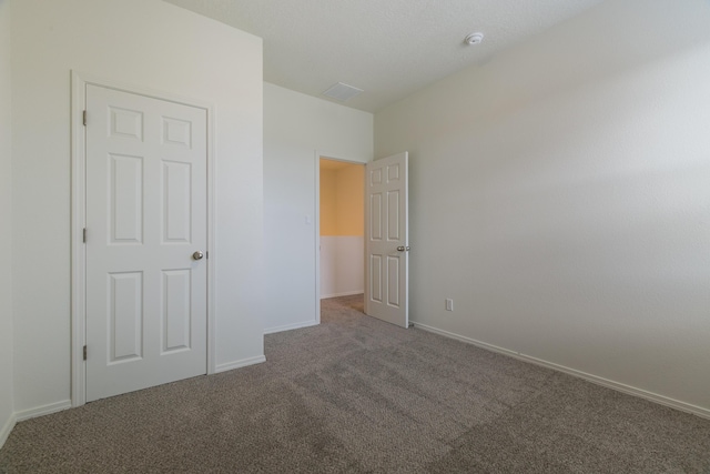 6213 White Hawk Dr NE, Rio Rancho, NM 87144 - unfurnished bedroom featuring carpet flooring and baseboards