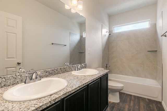6213 White Hawk Dr NE, Rio Rancho, NM 87144 - full bathroom featuring double vanity, wood finished floors, and bathing tub / shower combination