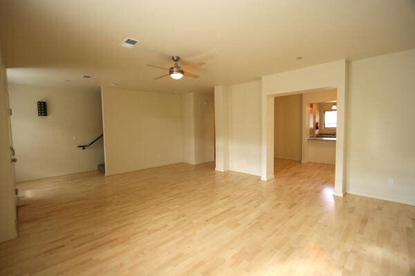 spare room with ceiling fan and light hardwood / wood-style floors